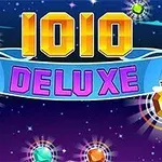 Tittelen 1010 Deluxe i fargerike bokstaver med lysende juveler mot en stjernespekket bakgrunn