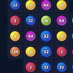 Et rutenett med fargerike, nummererte kuler, inkludert tallene 2, 4, 8, 16, 32, 64, og 128, på en svart bakgrunn