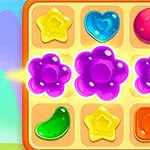 Fargerike geometriske former og figurer i et 3x3 rutenett, inkludert stjerner, hjerter og blomster mot en lyseblå bakgrunn