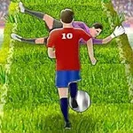 Fotballspiller i rød drakt med nummer 10 dribler en ball oppover en gresskledd rampe mens en keeper i lilla forsøker å stoppe ballen i et stadion fylt med publikum