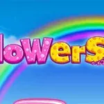 Ordet flowers i fargerik, blomsterdekorert skrift foran en regnbue og blå himmel