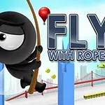 En tegneseriefigur i svart svinger seg i et tau mellom høyhus med en bro og en luftballong i bakgrunnen, og teksten Fly with Rope 2 vises