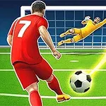 En fotballspiller i rødt sparker en ball mot mål, mens målvakten i gult forsøker å redde den