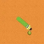 Grønn slange med tegneserieøyne beveger seg mot et stykke kiwi på en oransje bakgrunn