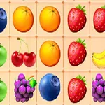 Et rutenett med fargerike frukter som blåbær, appelsiner, jordbær, epler, kirsebær, bananer og druer