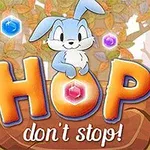 En tegnet blå kanin sitter på teksten HOP dont stop!