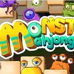Fargerike monstre omgir teksten Monster Mahjong på en bakgrunn av mursteinsblokker