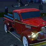 En rød vintage pickup-truck står parkert på en mørk kirkegård med gravstøtter i bakgrunnen