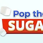 Teksten Pop the Sugar er plassert på en rød bakgrunn, omgitt av flygende sukkerbiter