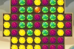 Fargerike frukter arrangert i et rutenett med lilla, grønne og gule bær samt en oransje frukt i midten