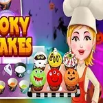 Tegneseriefigur iført kokkehatt holder brett med dekorative cupcakes med Halloween-tema foran en fargerik bakgrunn