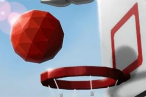 Rød geometrisk ball i ferd med å treffe en basketballkurv i dagslys