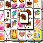 Fliser med fargerike bilder av forskjellige søtsaker som sjokolade, kaker, cupcakes og godteri