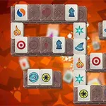 Et fargerikt brettspilldesign med ulike symboler på brikker mot en oransje bakgrunn