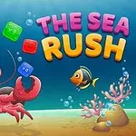 En tegneseriekrabbe med store øyne holder fargerike blokker under vann blant fisk og koraller, med teksten The Sea Rush i bakgrunnen