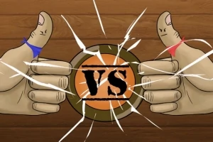 To tomler, hver med ulik farget tøybit, peker mot hverandre over en oransje sirkel med teksten VS og omgitt av sprekker
