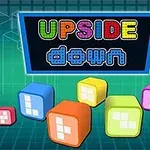Fargerike terninger med tall på en blå-grønn bakgrunn og teksten UPSIDE down