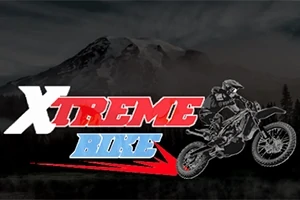 Illustrasjon av en motorsykkel i luften foran en fjellbakgrunn, med teksten Xtreme Bike i rødt og blått